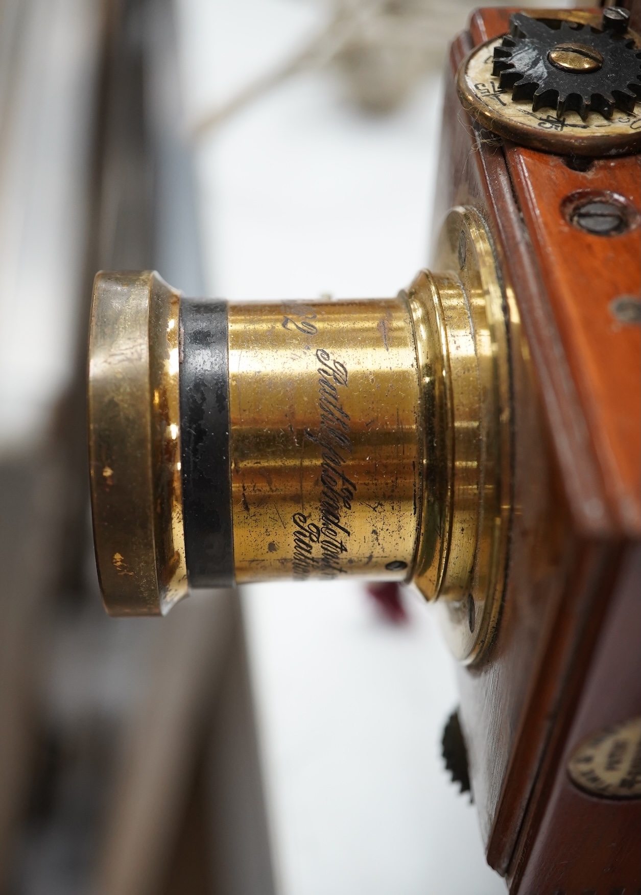 A late 19th/early 20th century brass and mahogany half plate bellows camera with a lens and a shutter action by Thornton Pickard. Condition - glass missing